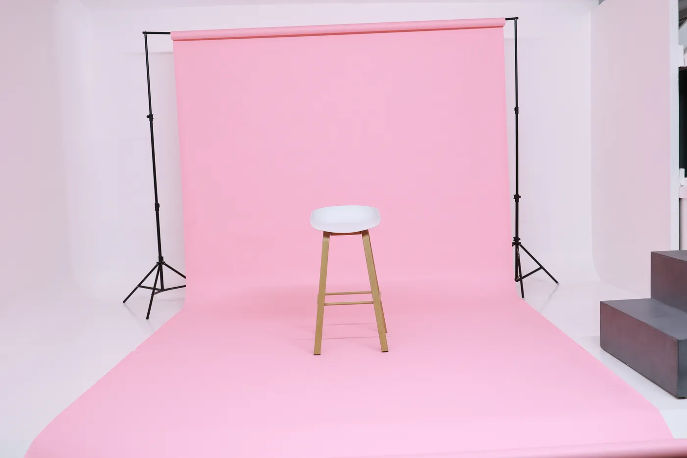 Blush pink seamless backdrop set up inside the studio
