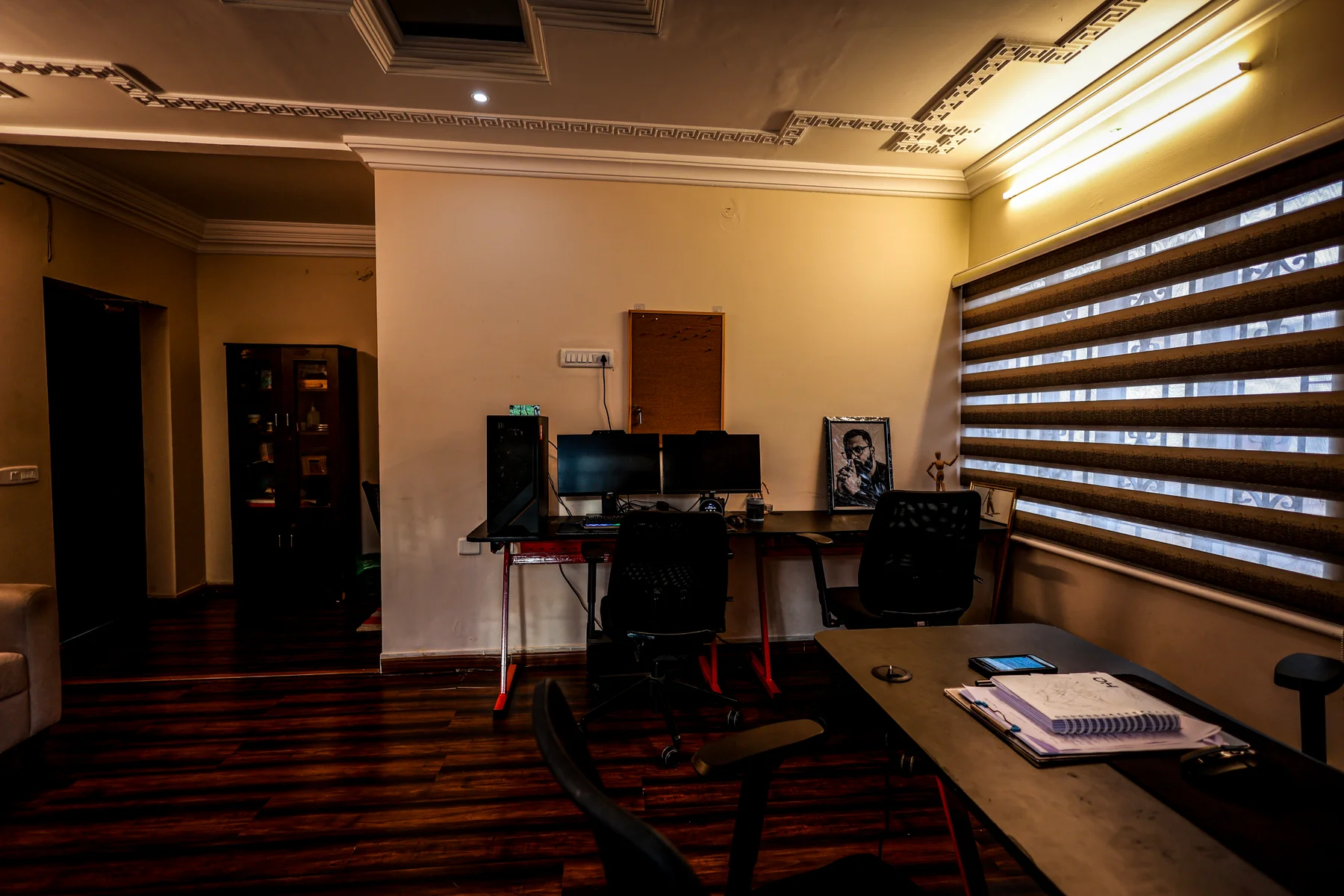 Desks, monitors and seating in the studio’s warm working room