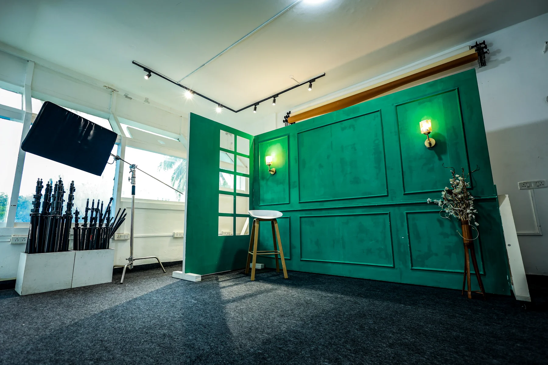 The green panelled set, window light and shooting space inside Trendtag Studio