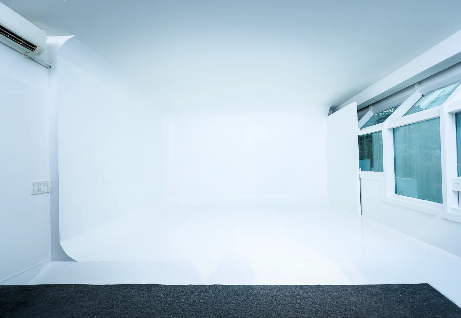 White cyclorama with a curved, seamless wall and floor