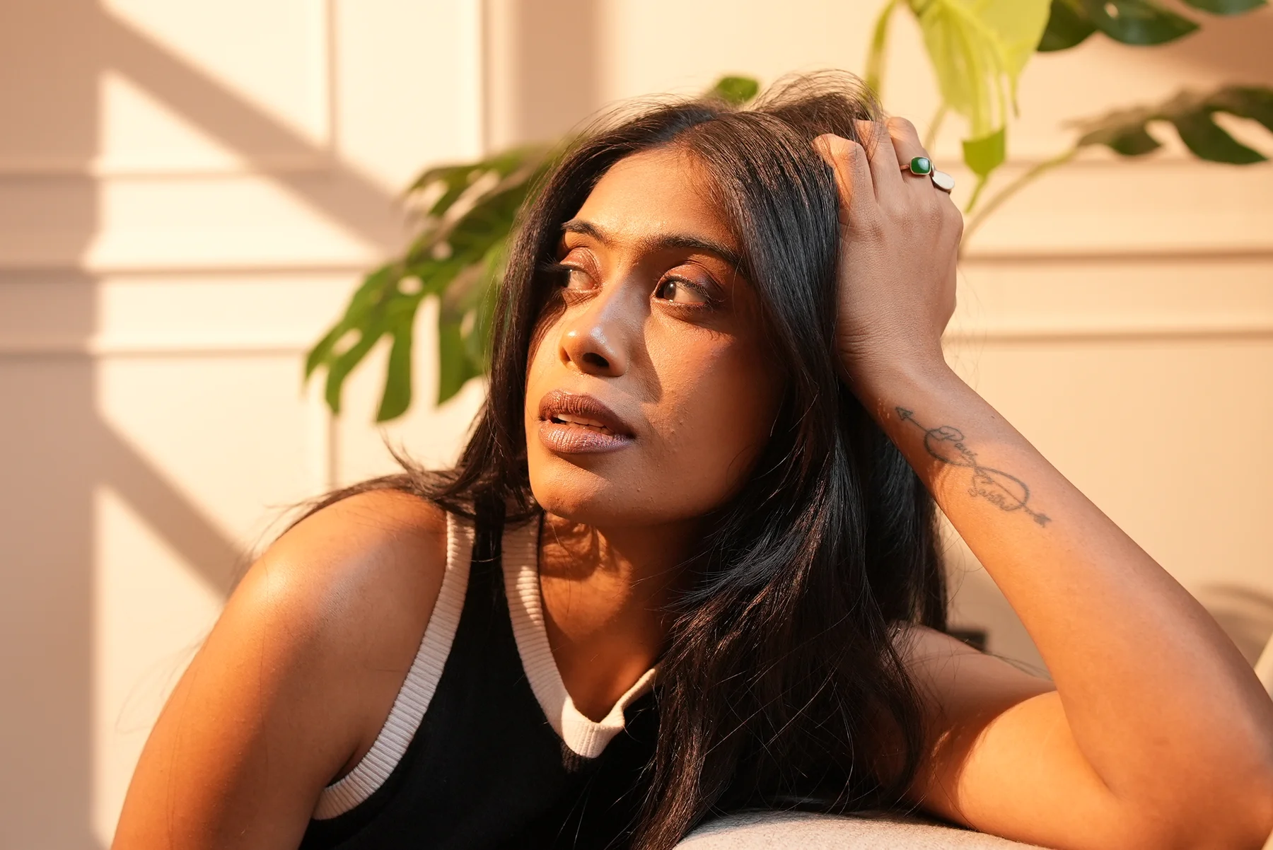 Close portrait in warm, window-shaped light